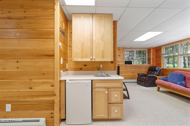 58 Rude Rd, Waymart, PA 18472 - kitchen with dishwasher, light brown cabinets, wooden walls, light carpet, and light countertops