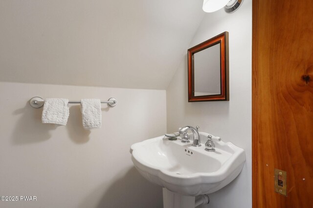 58 Rude Rd, Waymart, PA 18472 - bathroom with lofted ceiling and a sink