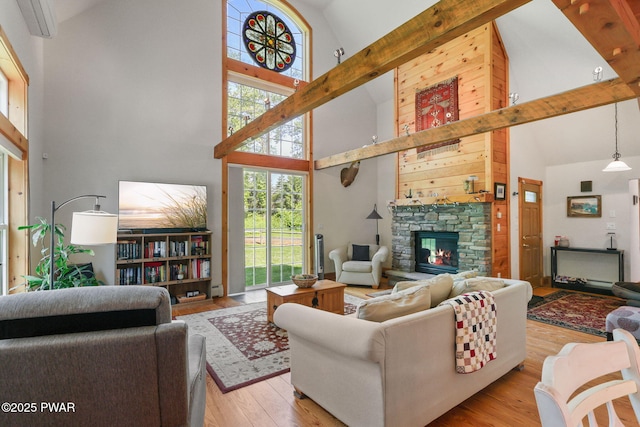 58 Rude Rd, Waymart, PA 18472 - living room featuring high vaulted ceiling, a fireplace, and wood finished floors