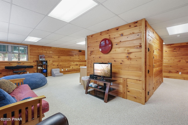 58 Rude Rd, Waymart, PA 18472 - carpeted living room with wood walls and a drop ceiling