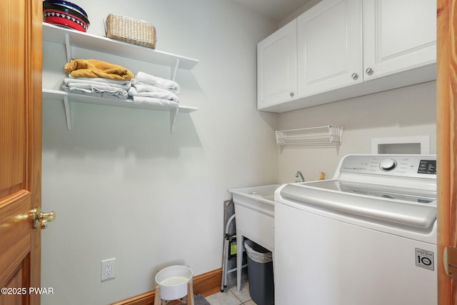 58 Rude Rd, Waymart, PA 18472 - laundry area with washer / dryer, cabinet space, and light tile patterned floors