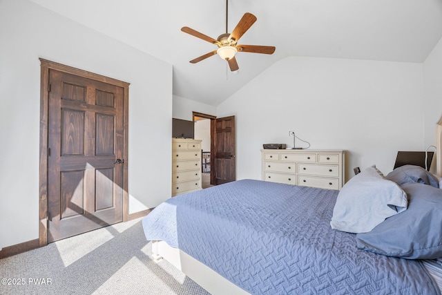 carpeted bedroom with a ceiling fan and lofted ceiling