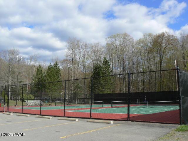 view of tennis court with fence
