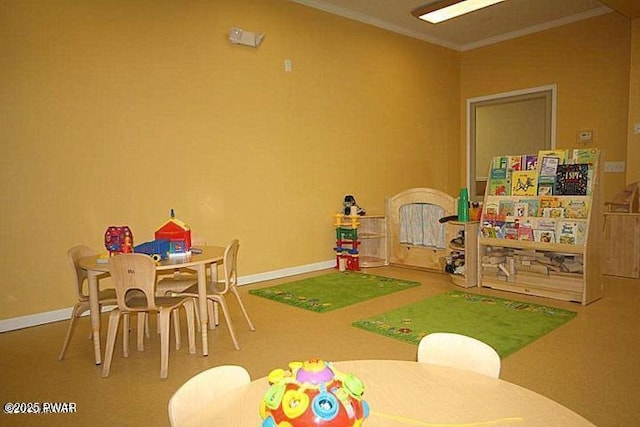 game room featuring baseboards and ornamental molding