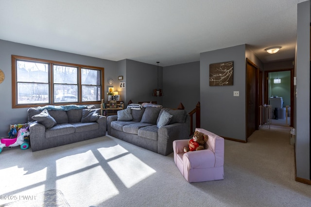 living room featuring baseboards and light carpet