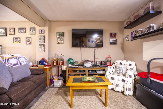 living room featuring beamed ceiling and carpet flooring