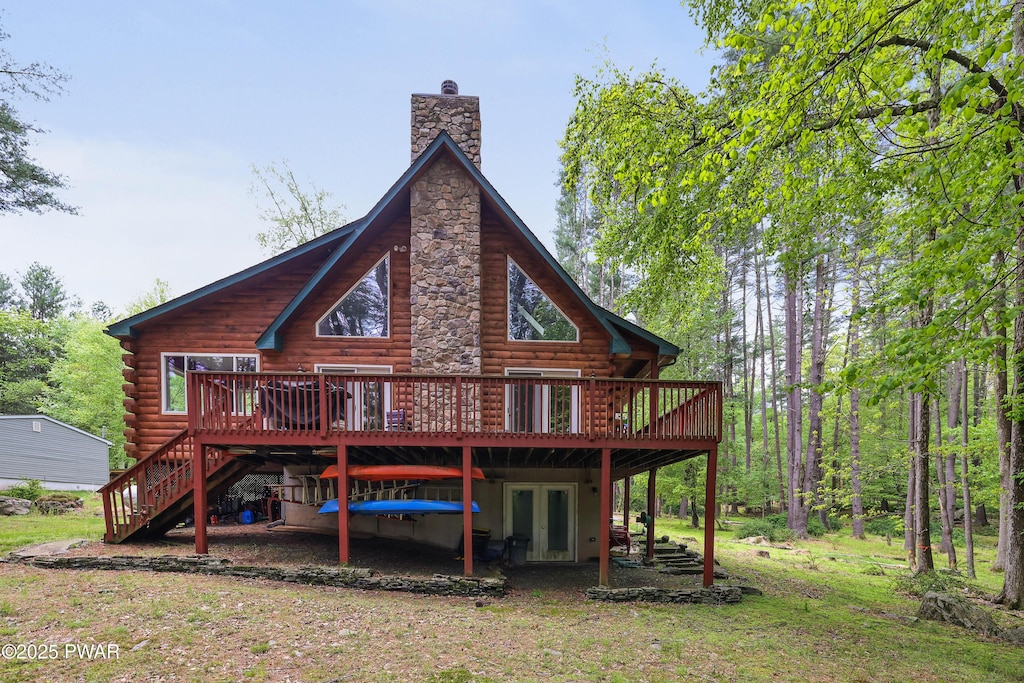 102 Bugle Ct, Lackawaxen, PA 18435 - back of house featuring a chimney, a deck, stairs, log siding, and french doors