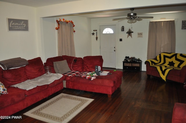 living room with ceiling fan and dark hardwood / wood-style floors