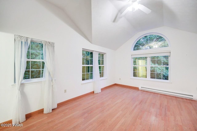 102 Eagle Rock Rd, Lackawaxen, PA 18435 - unfurnished room with a baseboard heating unit, vaulted ceiling, plenty of natural light, and light wood-style floors