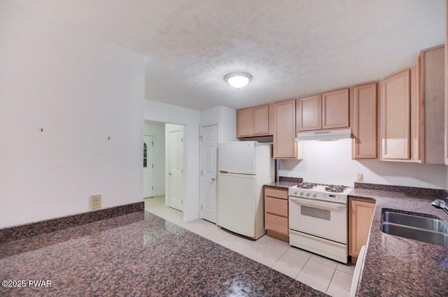 102 Eagle Rock Rd, Lackawaxen, PA 18435 - kitchen featuring white appliances, under cabinet range hood, light brown cabinetry, light tile patterned floors, and a textured ceiling