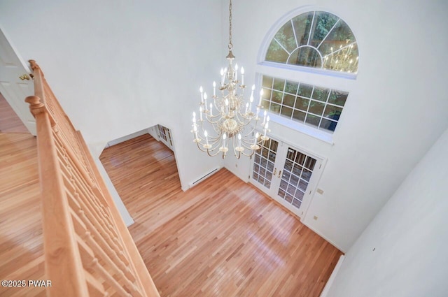 102 Eagle Rock Rd, Lackawaxen, PA 18435 - stairs with a high ceiling, a chandelier, wood finished floors, and french doors