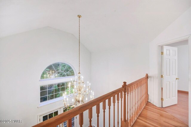 102 Eagle Rock Rd, Lackawaxen, PA 18435 - hallway with a chandelier, an upstairs landing, wood finished floors, and high vaulted ceiling