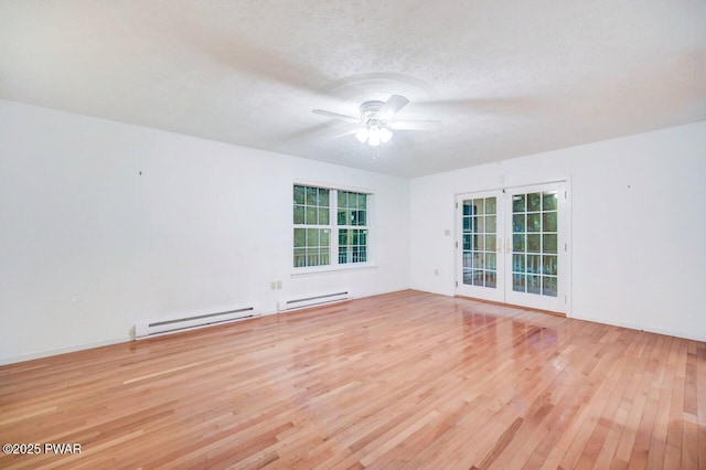 102 Eagle Rock Rd, Lackawaxen, PA 18435 - unfurnished room featuring wood finished floors, a baseboard heating unit, ceiling fan, french doors, and a textured ceiling