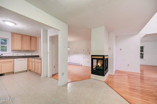 102 Eagle Rock Rd, Lackawaxen, PA 18435 - kitchen with dishwasher, a baseboard heating unit, light brown cabinets, dark countertops, and open floor plan