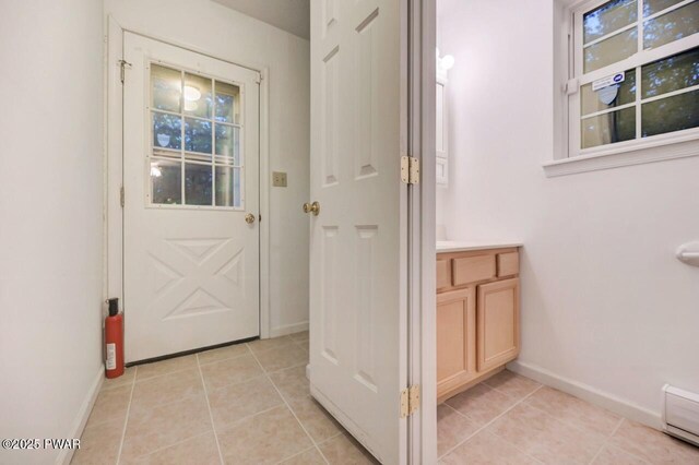 102 Eagle Rock Rd, Lackawaxen, PA 18435 - entryway with light tile patterned flooring and a baseboard radiator