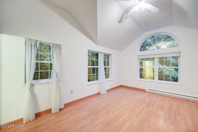 102 Eagle Rock Rd, Lackawaxen, PA 18435 - spare room featuring lofted ceiling, light wood finished floors, ceiling fan, and a baseboard heating unit