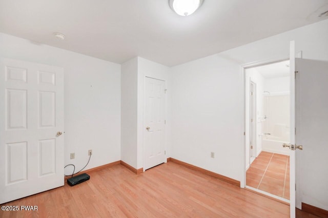 102 Eagle Rock Rd, Lackawaxen, PA 18435 - unfurnished bedroom with light wood-style flooring and connected bathroom