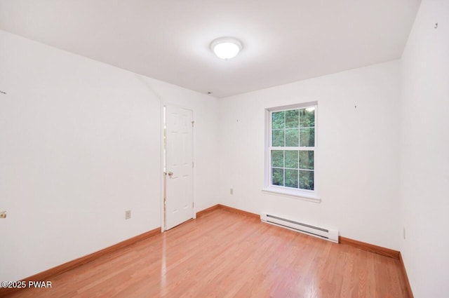 102 Eagle Rock Rd, Lackawaxen, PA 18435 - spare room with a baseboard radiator and light wood-style flooring
