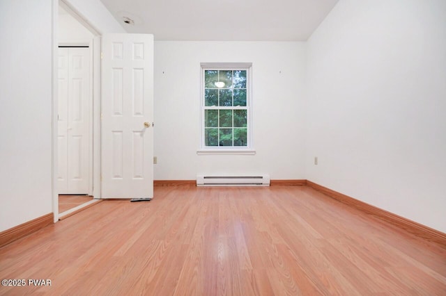 102 Eagle Rock Rd, Lackawaxen, PA 18435 - unfurnished bedroom featuring baseboard heating and light wood-style flooring