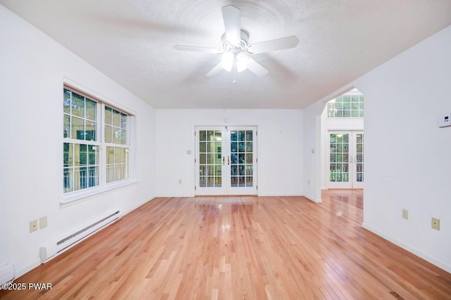 102 Eagle Rock Rd, Lackawaxen, PA 18435 - spare room featuring french doors, a baseboard radiator, light wood finished floors, and ceiling fan