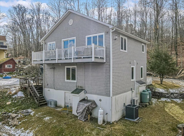 rear view of property featuring cooling unit