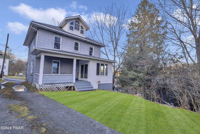 view of front of home featuring a porch and a front yard