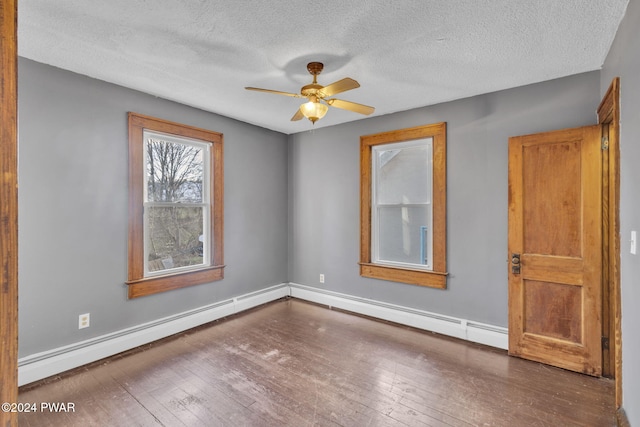 unfurnished room with a textured ceiling, ceiling fan, a baseboard radiator, and dark hardwood / wood-style floors