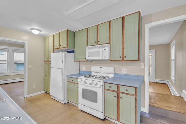 kitchen featuring white appliances, light hardwood / wood-style flooring, and a baseboard radiator