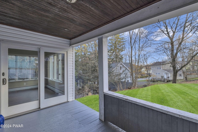 unfurnished sunroom featuring wood ceiling and baseboard heating