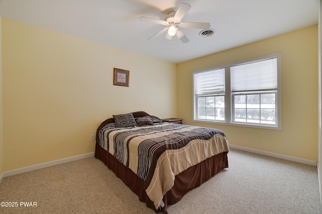 bedroom with light carpet, baseboards, visible vents, and ceiling fan