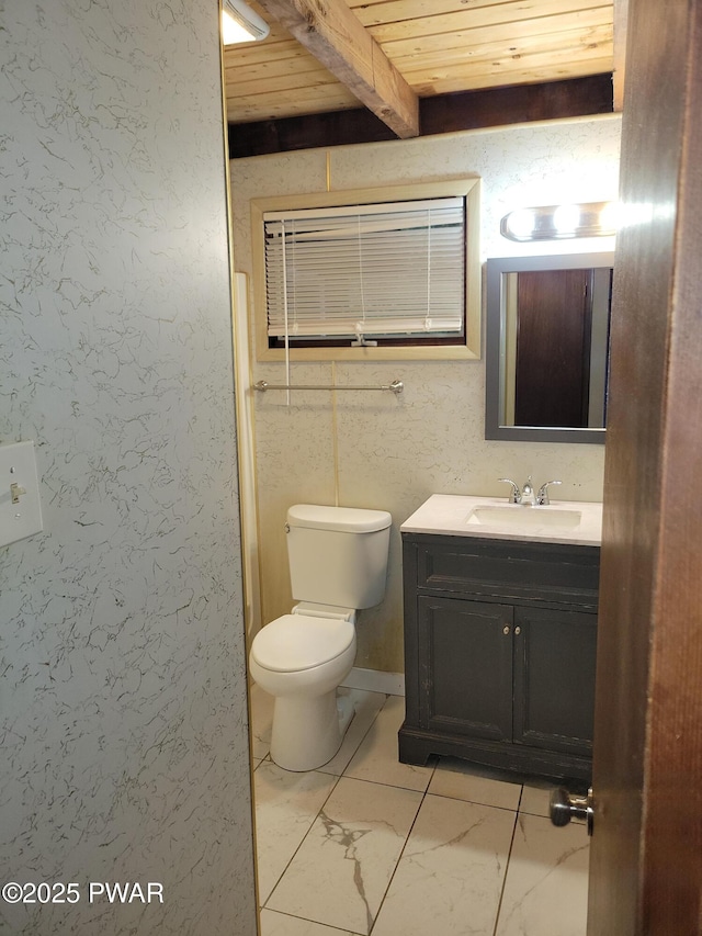 803 Lariat Ct, Hawley, PA 18428 - bathroom with vanity, toilet, marble look tiles, and wooden ceiling with exposed beams