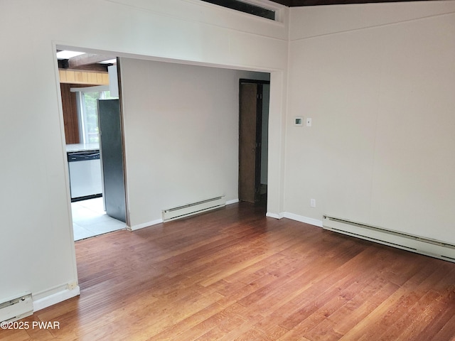 803 Lariat Ct, Hawley, PA 18428 - unfurnished room featuring baseboard heating, wood finished floors, a baseboard radiator, and baseboards