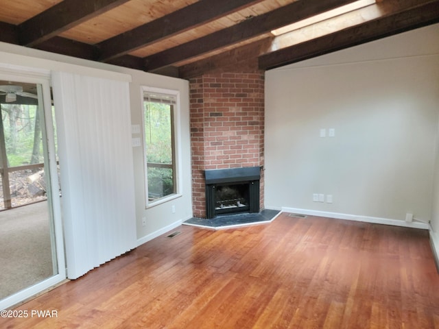803 Lariat Ct, Hawley, PA 18428 - unfurnished living room with wood finished floors, a brick fireplace, baseboards, and wood ceiling