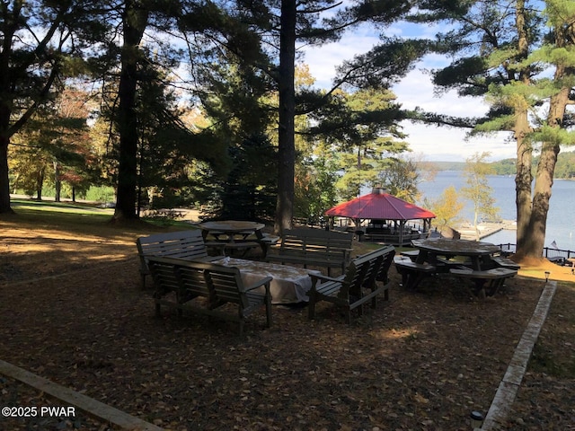 view of yard featuring a water view and a gazebo