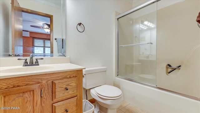 full bathroom with toilet, vanity, tile patterned flooring, a ceiling fan, and combined bath / shower with glass door