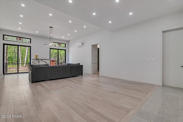 517 Maple Ridge Dr, Lords Valley, PA 18428 - living room with recessed lighting, light wood-style flooring, and an AC wall unit