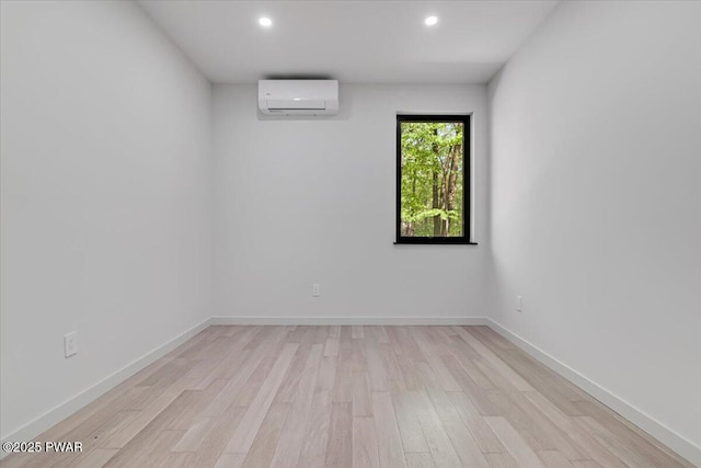 517 Maple Ridge Dr, Lords Valley, PA 18428 - empty room with a wall mounted AC, light wood-style floors, recessed lighting, and baseboards