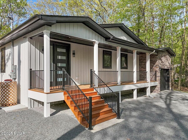 517 Maple Ridge Dr, Lords Valley, PA 18428 - view of front of home with covered porch and stone siding