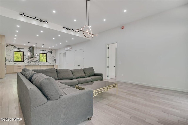 517 Maple Ridge Dr, Lords Valley, PA 18428 - living area featuring light wood finished floors, recessed lighting, and a wall mounted AC
