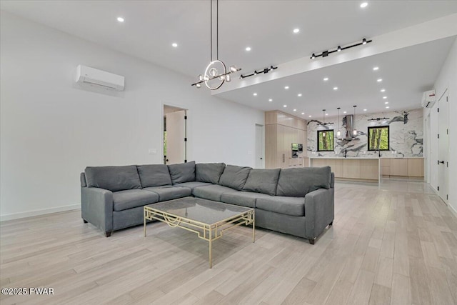 517 Maple Ridge Dr, Lords Valley, PA 18428 - living area featuring a wall mounted AC, light wood-type flooring, recessed lighting, and a chandelier