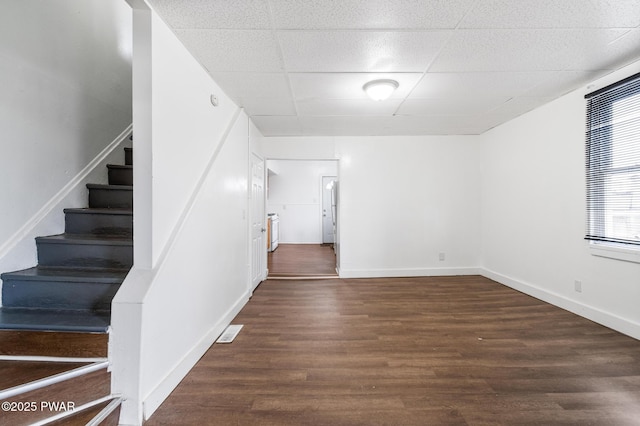 interior space with hardwood / wood-style floors and a paneled ceiling