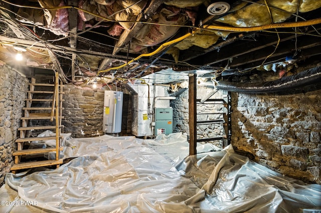 basement featuring heating unit and electric water heater