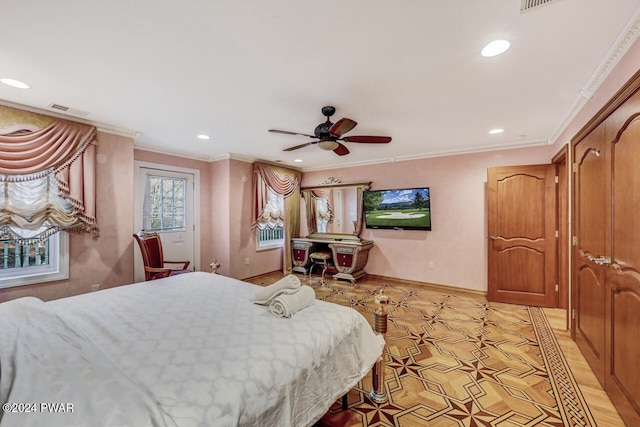 bedroom with ceiling fan and crown molding