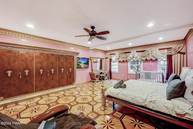 bedroom with ceiling fan and ornamental molding