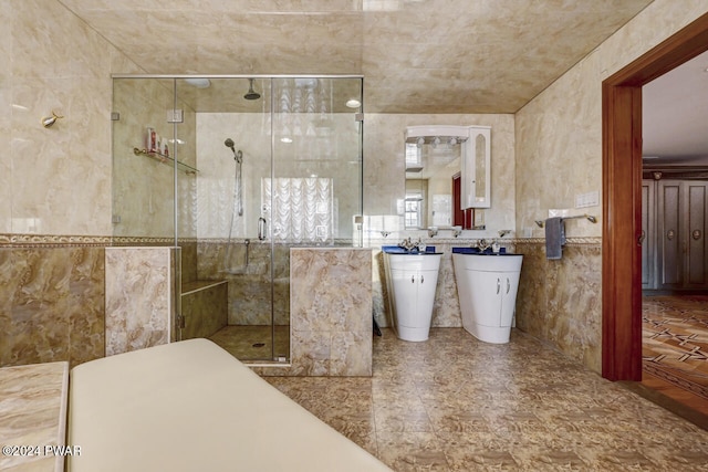 bathroom with an enclosed shower, toilet, and tile walls