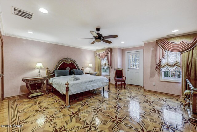 bedroom with ceiling fan and crown molding