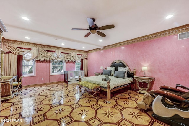 bedroom featuring ceiling fan and crown molding