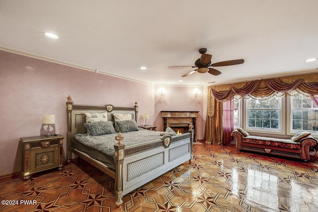 bedroom featuring ceiling fan and ornamental molding