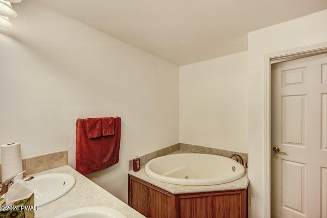 bathroom with vanity and a bathtub