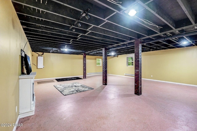 basement featuring a baseboard heating unit